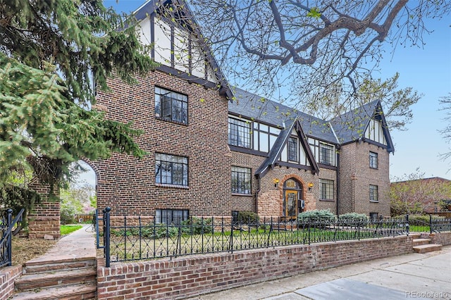 view of building exterior featuring a fenced front yard
