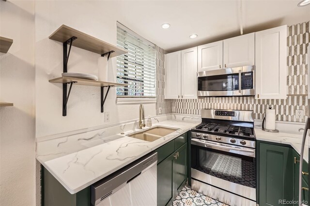 2233 Kearney St Unit 19, Denver, CO 80207 - kitchen featuring open shelves, white cabinets, a sink, green cabinets, and stainless steel appliances