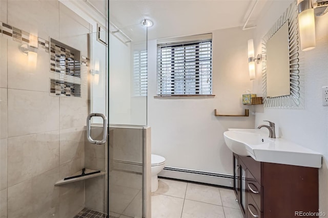 full bath featuring baseboard heating, tile patterned flooring, vanity, toilet, and a shower stall
