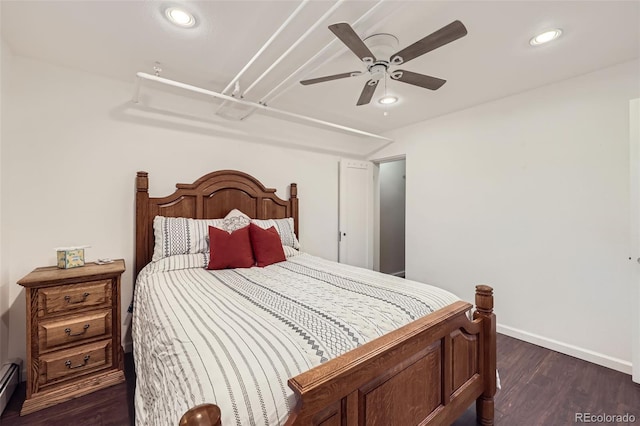 bedroom featuring baseboards, baseboard heating, recessed lighting, dark wood-type flooring, and a ceiling fan
