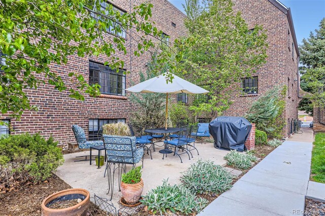 2233 Kearney St Unit 19, Denver, CO 80207 - view of patio / terrace featuring area for grilling and outdoor dining space