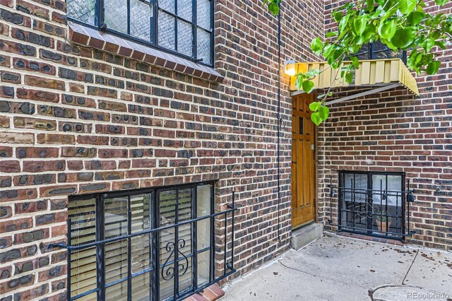 2233 Kearney St Unit 19, Denver, CO 80207 - property entrance featuring brick siding