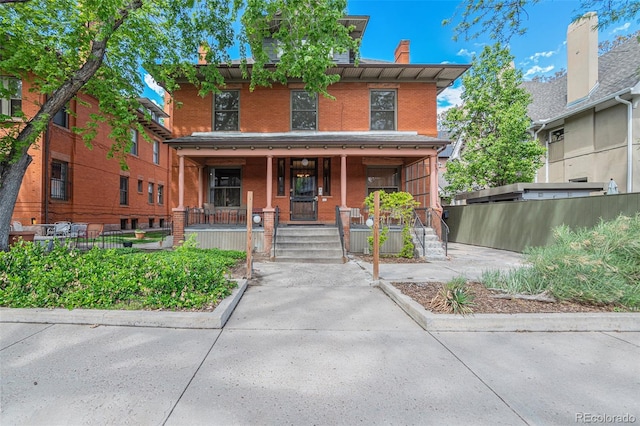 italianate home featuring covered porch