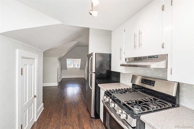 kitchen with dark hardwood / wood-style floors, tasteful backsplash, lofted ceiling, white cabinets, and stainless steel range with gas stovetop