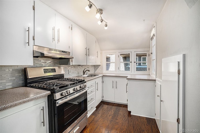 kitchen with white cabinetry, gas range, and sink