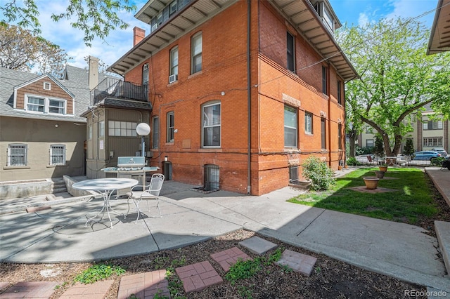 rear view of property featuring a patio