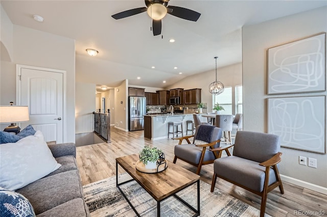 4318 Hessite Loop, Colorado Springs, CO 80938 - living room featuring ceiling fan, light wood-style flooring, lofted ceiling, a chandelier, and recessed lighting
