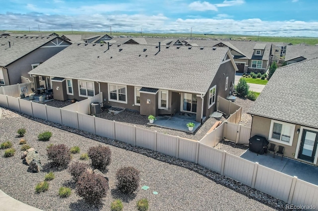 4318 Hessite Loop, Colorado Springs, CO 80938 - back of property featuring a residential view, a patio, a fenced backyard, stucco siding, and a gate