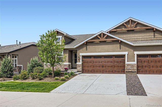 4318 Hessite Loop, Colorado Springs, CO 80938 - craftsman inspired home with stone siding, a garage, stucco siding, and concrete driveway