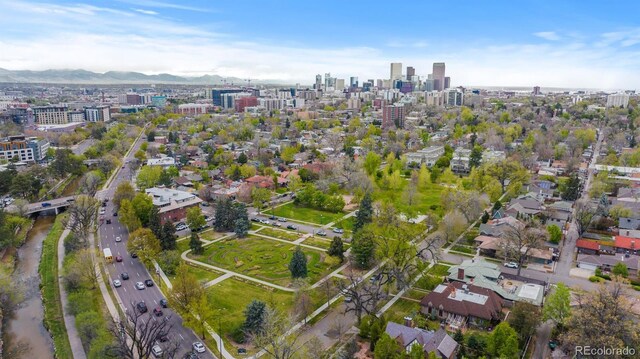 aerial overview of property's location with nearby urban area and mountains