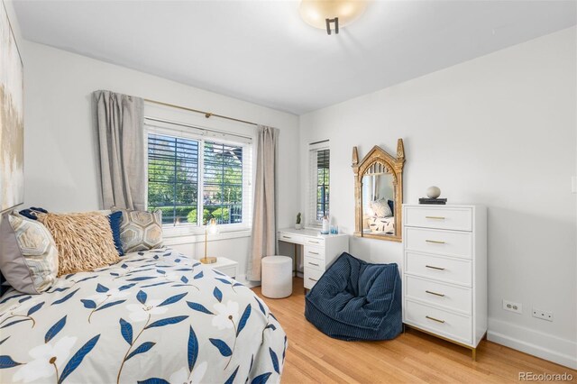bedroom featuring light wood-style flooring