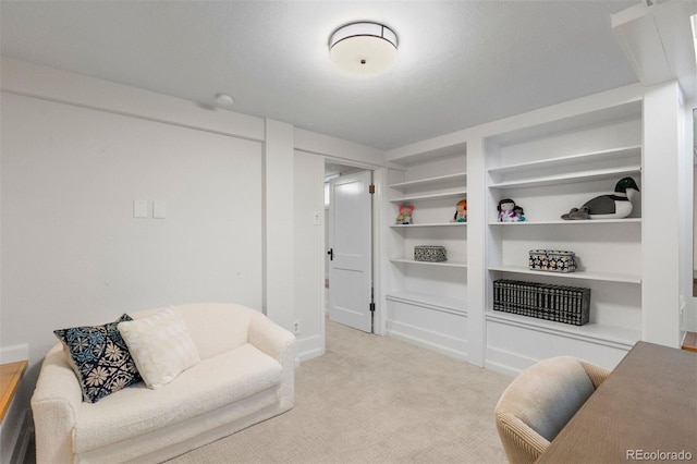 living room with light carpet, built in features, and baseboards