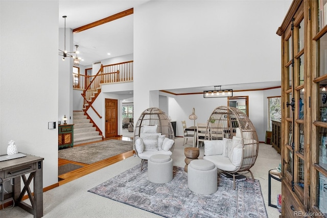 1 Amaranth Dr, Littleton, CO 80127 - sitting room featuring a high ceiling, a chandelier, stairway, recessed lighting, and carpet flooring