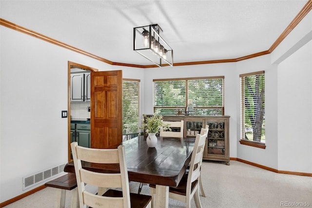 1 Amaranth Dr, Littleton, CO 80127 - dining area with ornamental molding and light carpet