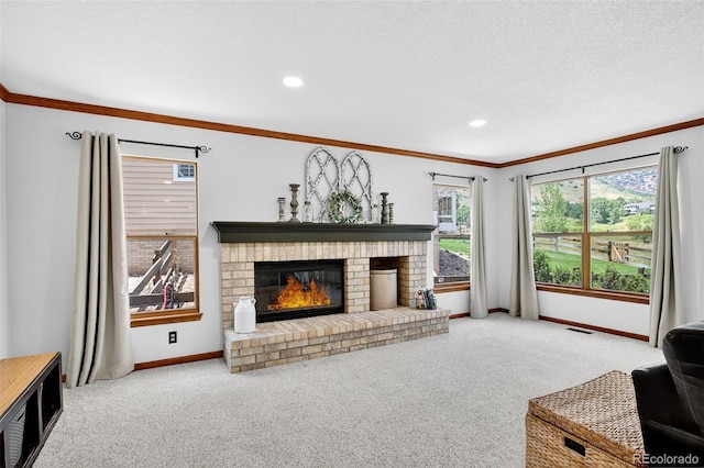 1 Amaranth Dr, Littleton, CO 80127 - carpeted living room featuring ornamental molding, a brick fireplace, and recessed lighting