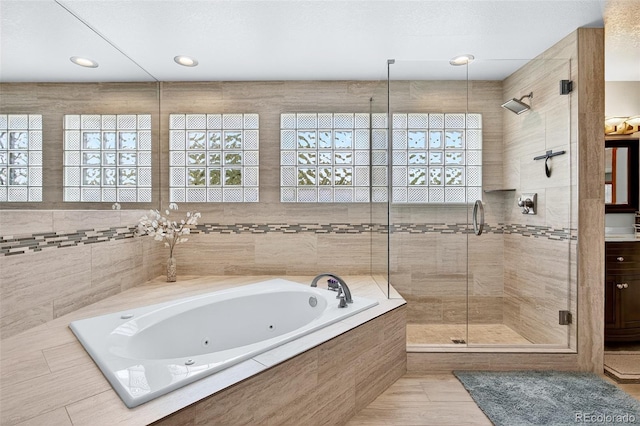 1 Amaranth Dr, Littleton, CO 80127 - bathroom featuring a whirlpool tub and a stall shower