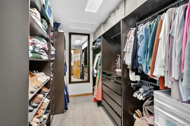 1 Amaranth Dr, Littleton, CO 80127 - walk in closet featuring attic access and wood finished floors