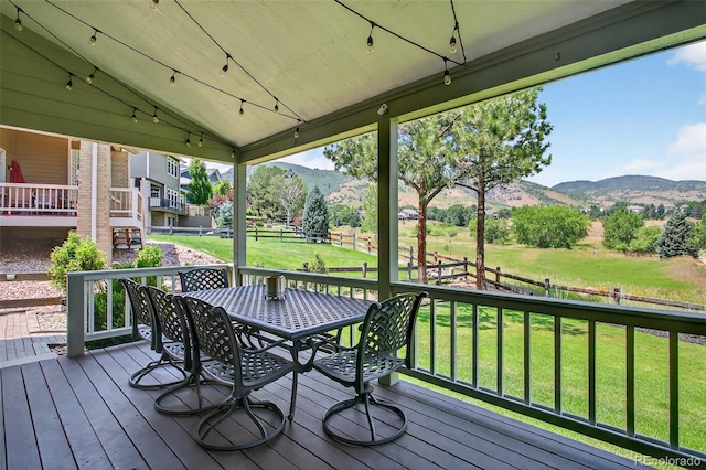 1 Amaranth Dr, Littleton, CO 80127 - wooden terrace featuring a mountain view and outdoor dining area
