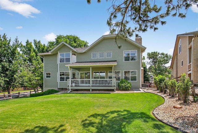 1 Amaranth Dr, Littleton, CO 80127 - rear view of property featuring a chimney
