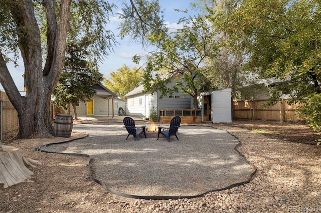 view of yard with a patio area and a fire pit