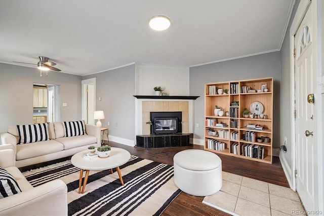 living room with ceiling fan, light hardwood / wood-style flooring, and ornamental molding