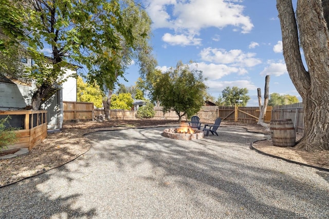 view of yard featuring a patio area and an outdoor fire pit