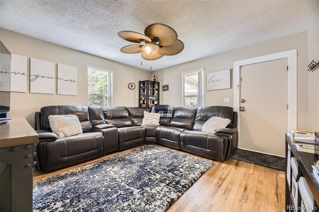 5510 S Windermere St, Littleton, CO 80120 - living area featuring ceiling fan, hardwood / wood-style flooring, and a textured ceiling