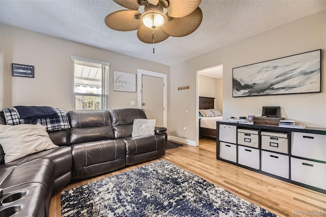 5510 S Windermere St, Littleton, CO 80120 - living area featuring wood finished floors, a ceiling fan, a textured ceiling, and baseboards