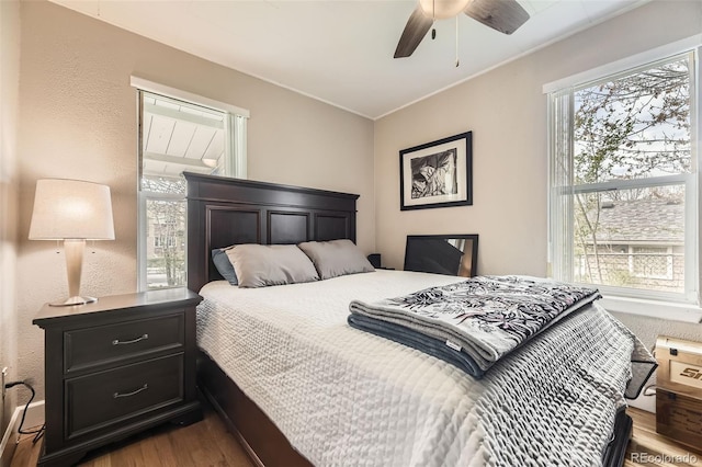 5510 S Windermere St, Littleton, CO 80120 - bedroom with dark wood-style flooring, crown molding, and ceiling fan