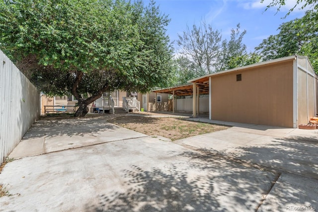 6871 Locust St, Commerce City, CO 80022 - view of yard featuring a patio and a carport