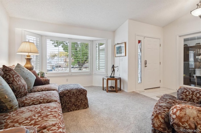 carpeted living room with lofted ceiling and a textured ceiling