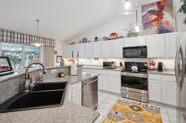 kitchen with pendant lighting, stainless steel appliances, sink, and white cabinets