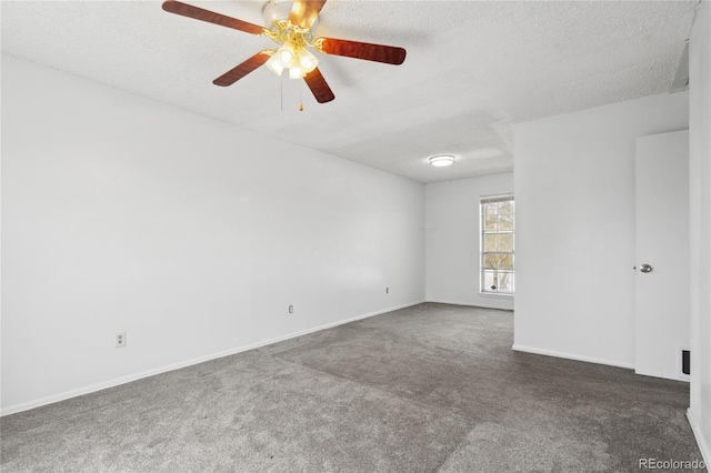 empty room with baseboards, carpet, a ceiling fan, and a textured ceiling