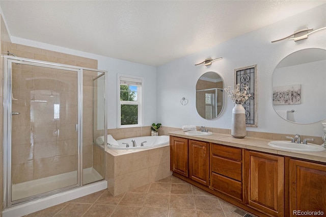 2749 Pemberly Ave, Highlands Ranch, CO 80126 - bathroom featuring tile patterned flooring, a stall shower, a bath, and double vanity