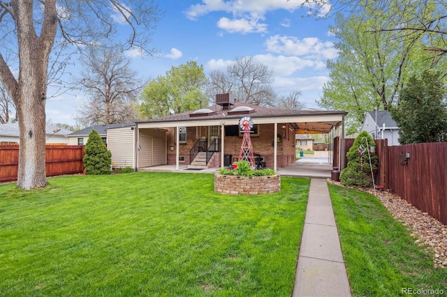2989 S Corona St, Englewood, CO 80113 - rear view of house with brick siding and a patio