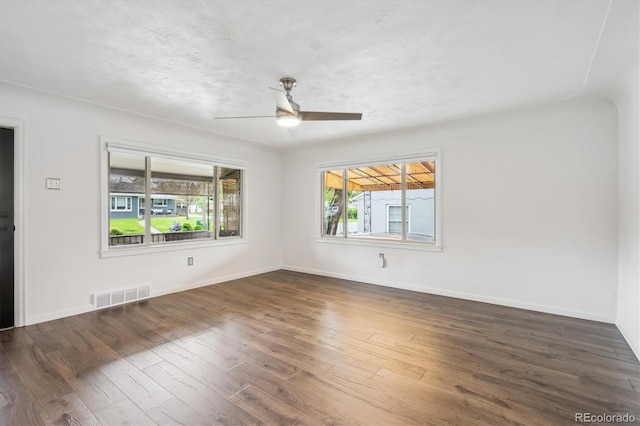2989 S Corona St, Englewood, CO 80113 - spare room featuring hardwood / wood-style flooring, ceiling fan, and baseboards