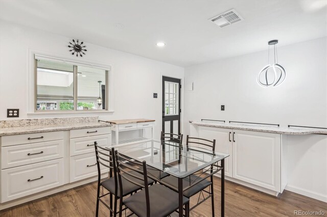 2989 S Corona St, Englewood, CO 80113 - dining area with dark wood-type flooring, healthy amount of natural light, recessed lighting, and baseboards
