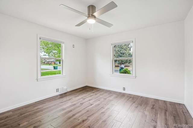 2989 S Corona St, Englewood, CO 80113 - spare room with plenty of natural light, wood finished floors, baseboards, and a ceiling fan