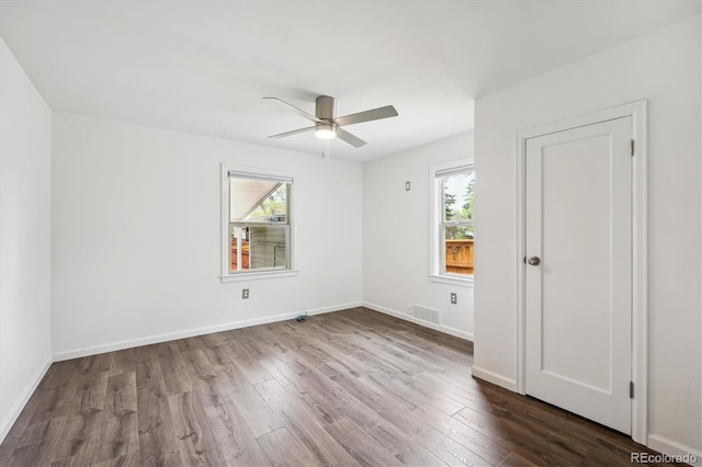 2989 S Corona St, Englewood, CO 80113 - unfurnished room with plenty of natural light, wood finished floors, and ceiling fan