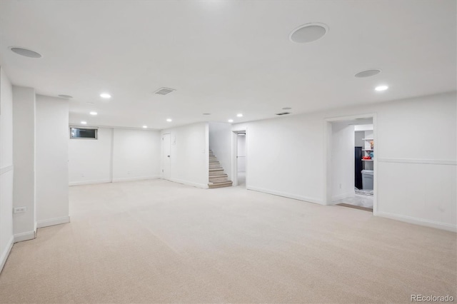 2989 S Corona St, Englewood, CO 80113 - finished basement with stairway, light colored carpet, recessed lighting, and baseboards