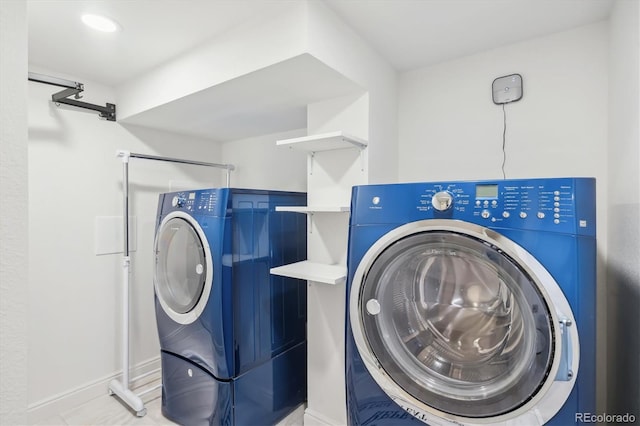 2989 S Corona St, Englewood, CO 80113 - washroom featuring washer and clothes dryer and baseboards