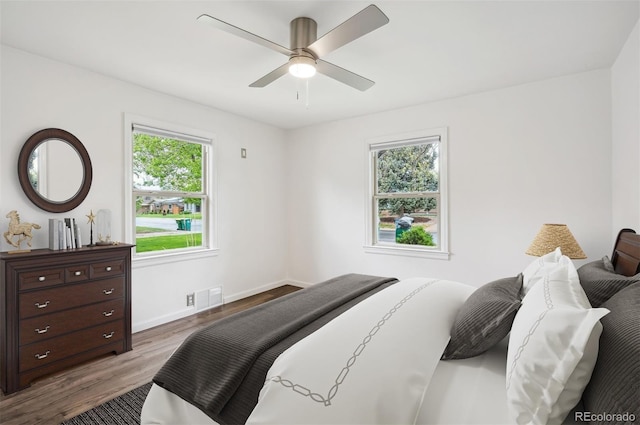 2989 S Corona St, Englewood, CO 80113 - bedroom with wood finished floors, baseboards, and a ceiling fan