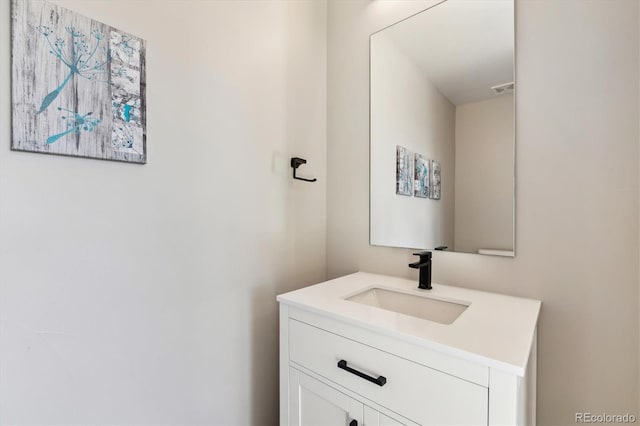 bathroom with visible vents and vanity