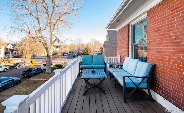 wooden deck featuring an outdoor hangout area