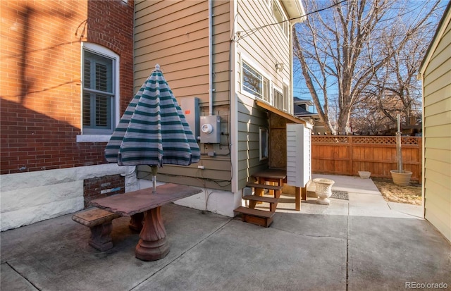 view of patio featuring fence