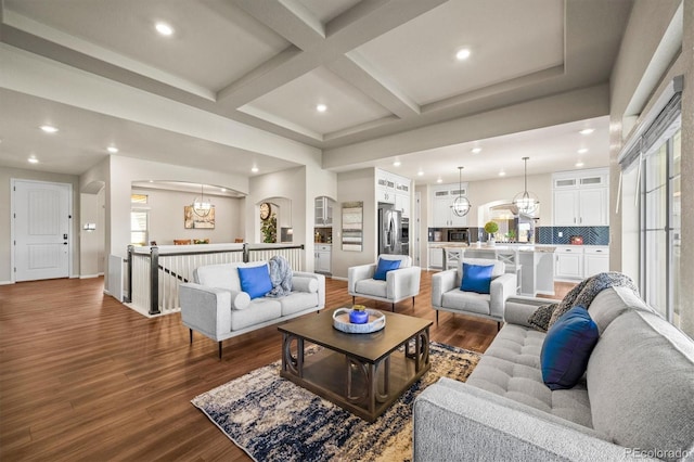 living room featuring beamed ceiling, coffered ceiling, wood finished floors, and recessed lighting