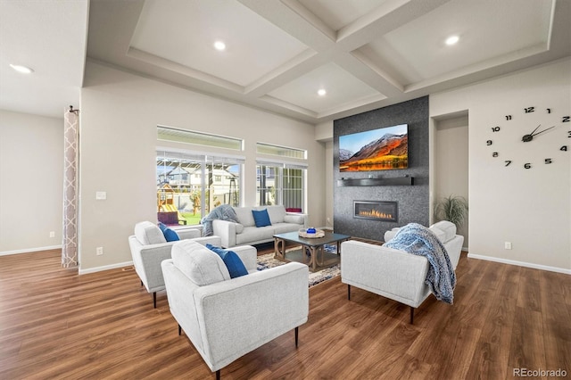 living room with a large fireplace, wood finished floors, coffered ceiling, beamed ceiling, and baseboards