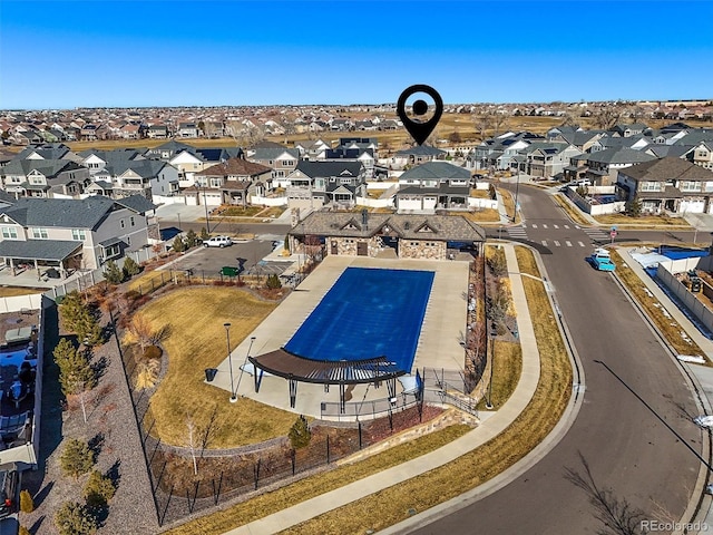 view of swimming pool with a residential view