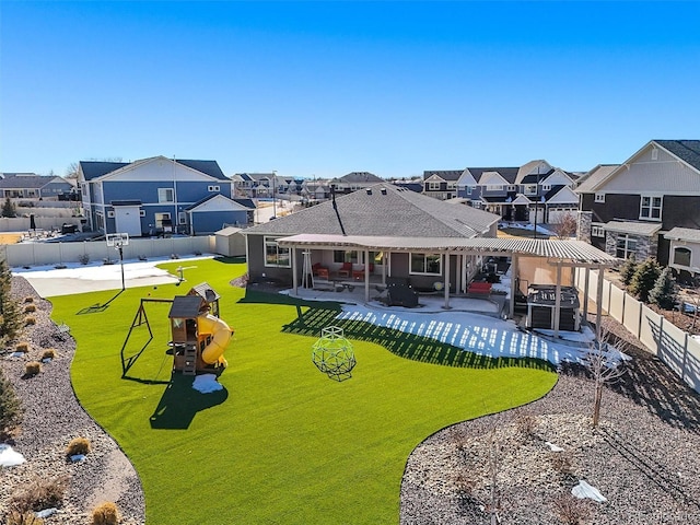 back of property with a residential view, a pergola, a playground, and a patio