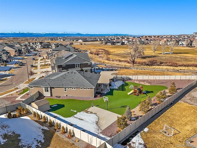 birds eye view of property with a residential view